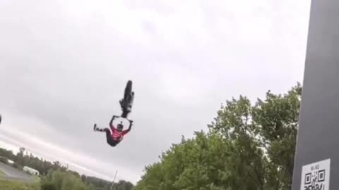 German motocross star Luc Ackermann lands insane backflip between two moving trucks