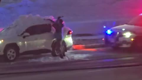 Driver Forced To Clean Snow Off Car