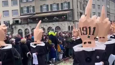 Liberals in Switzerland stage protest against Trump’s policies as they wear