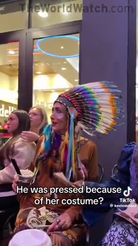 man dressed as a woman attacks a woman dressed as a native American