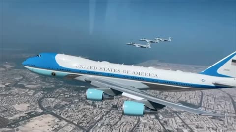 view from above as F-15QA Multirole Strike Fighters of the Qatar escort Air Force One into Qatar