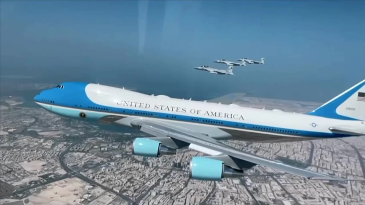view from above as F-15QA Multirole Strike Fighters of the Qatar escort Air Force One into Qatar