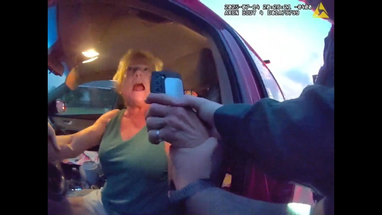 Woman is Furious With Officers During Traffic Stop, Then Drives Off