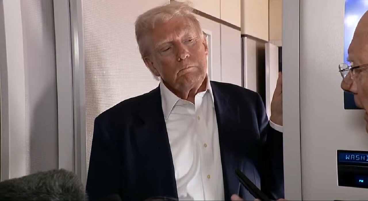 President Donald Trump answers questions on Air Force 1