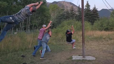 Men Play On Redneck Merry-Go-Round