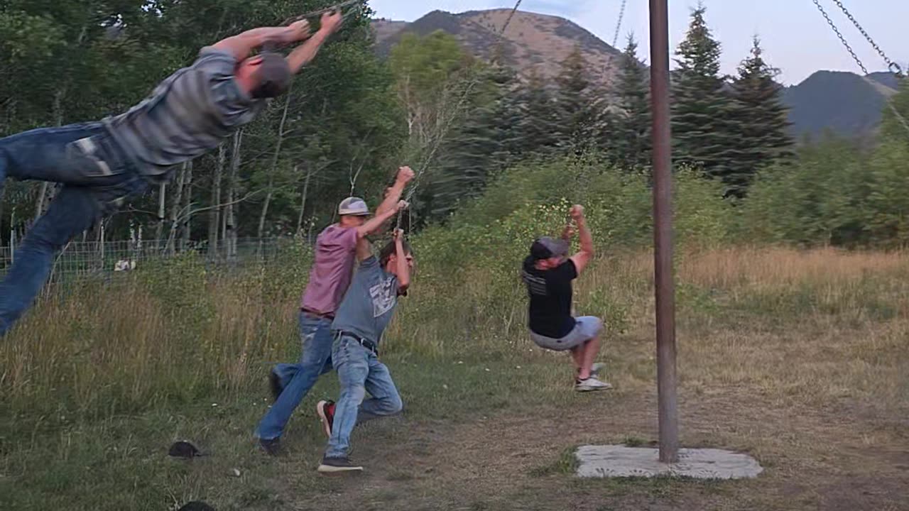 Men Play On Redneck Merry-Go-Round