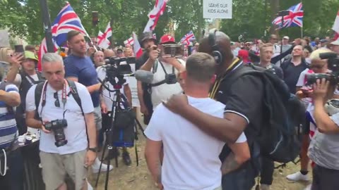 Thousands of UK rival football fans protest illegal immigrants together