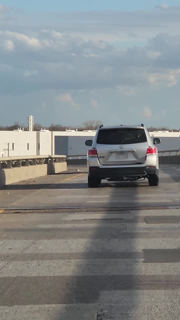 Wrecked Car Driving Off Ramp With Hood Up