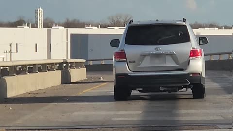 Wrecked Car Driving Off Ramp With Hood Up