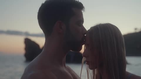 Lovely couple kissing at the beach