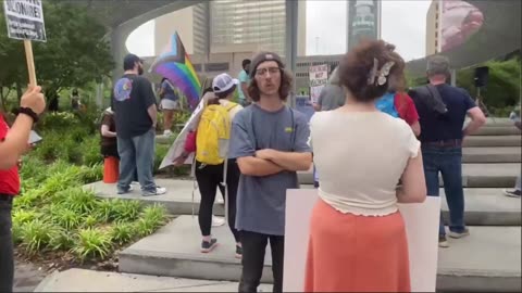 Milkmoder annoying a soy boy at the Dallas Mayday protest