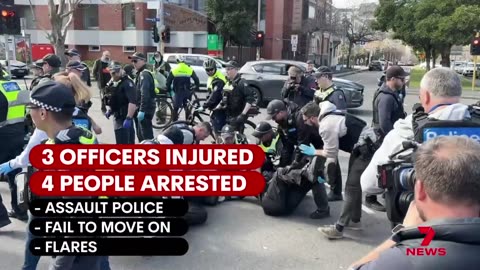 Police officers injured trying to keep the peace between feuding protest groups in the city