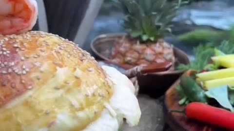 Cooking seafood burger in nature