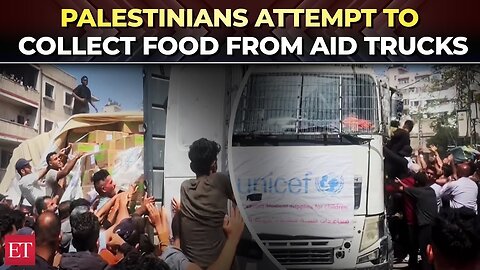 Palestinians attempt to get food parcels as aid trucks arrive in Gaza City