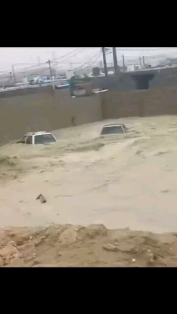 The Tolou earthen dam broke, sending water rushing into streets and houses in Iran.