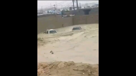 The Tolou earthen dam broke, sending water rushing into streets and houses in Iran.