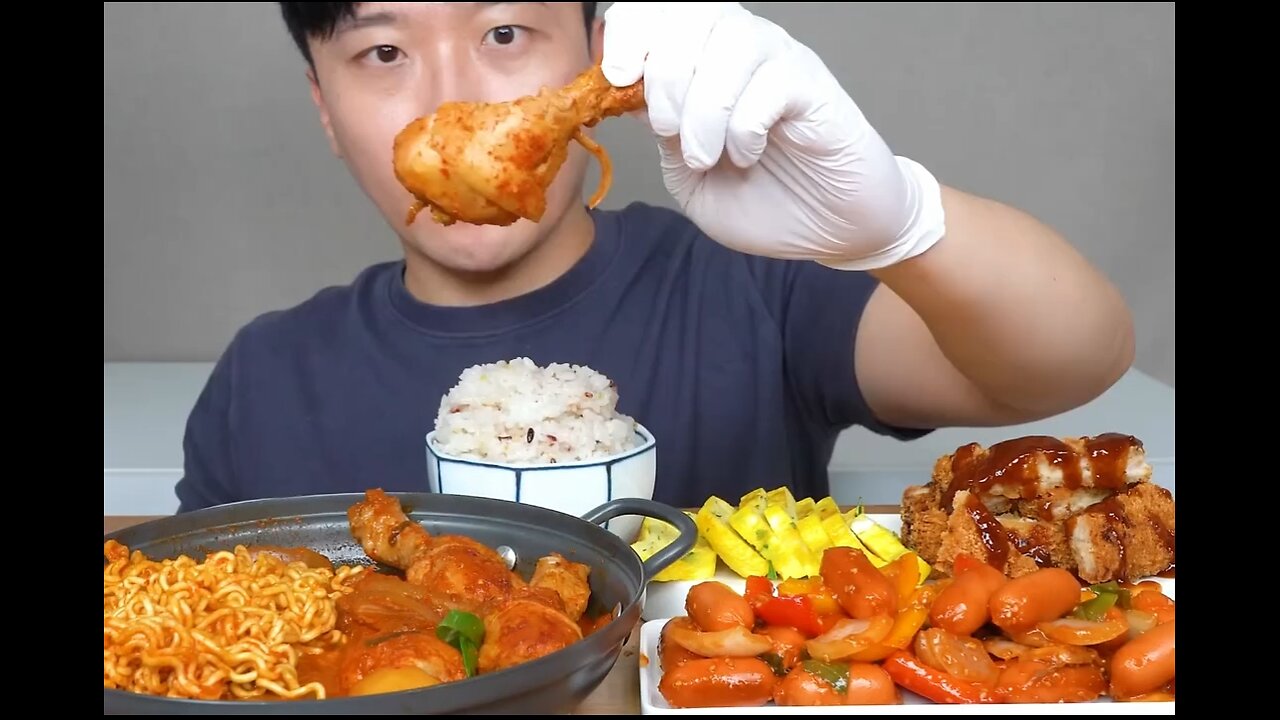 Chicken legs stewed with kimchi, fried sausage and vegetables, egg rolls, fried pork chops