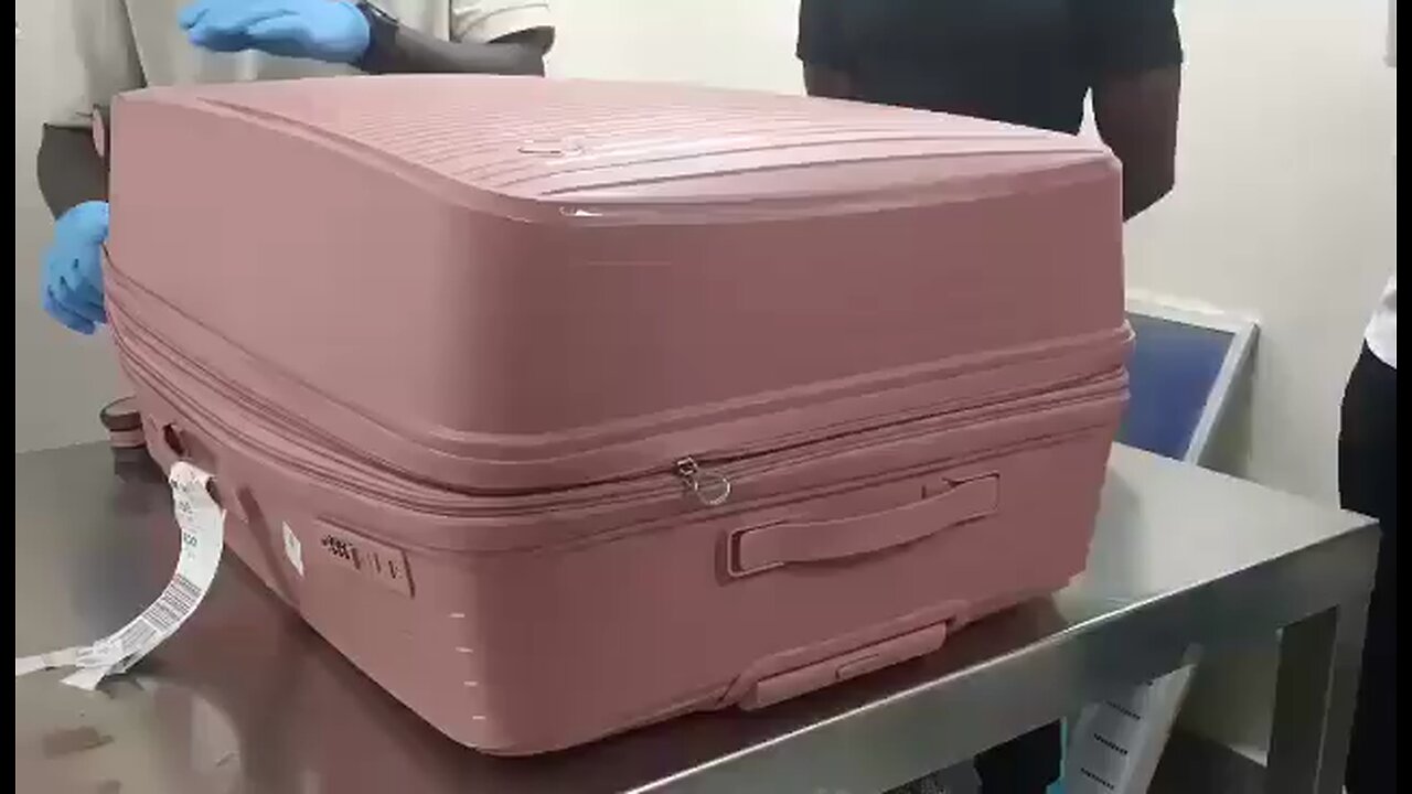 Intercepted trying to smuggle drugs ( marijuana ) At the airport