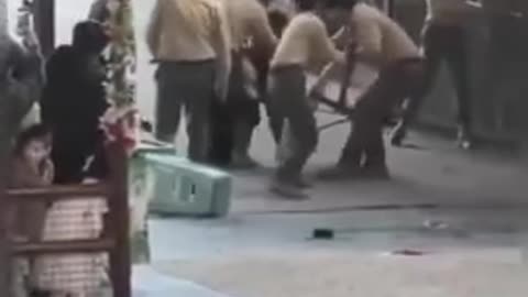 A bear, exhausted from abuse, attacks its trainer even after its teeth and claws have been removed.