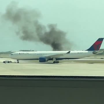 Passengers evacuate Delta Airlines flight at Orlando International Airport after engine fire