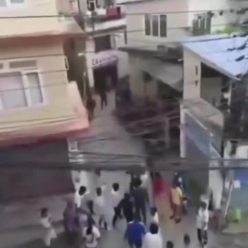 Nepalese Finance Minister socked & hammered on the streets of Nepal as he tries to flee on foot.