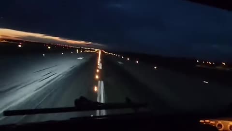 Evening approach and landing of a Boeing 737 MAX 8 at the rainy Prague airport