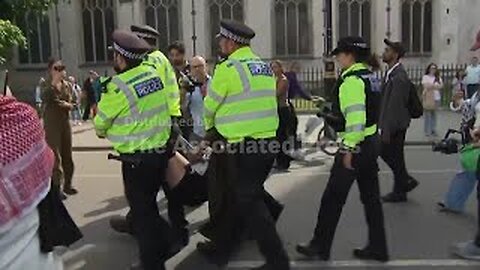 Activists rally in support of group designated as terrorist by UK government