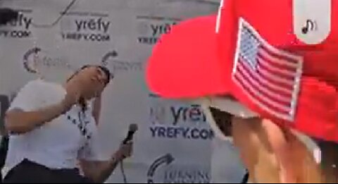 Close up front view of Charlie Kirk getting shot in the neck in front of crowd