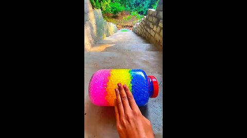 Incredible different colours of bottles falling from stairs to check hardness