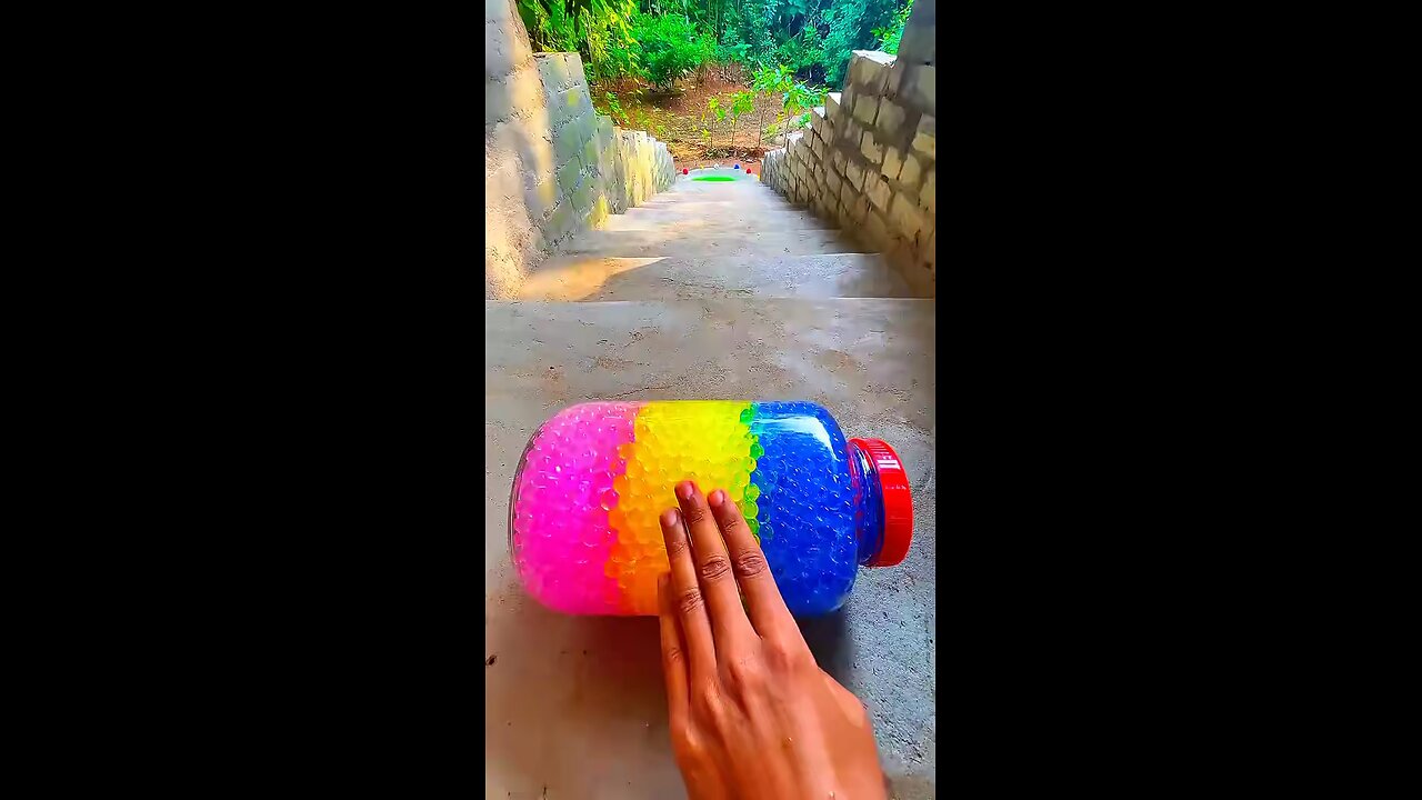 Incredible different colours of bottles falling from stairs to check hardness