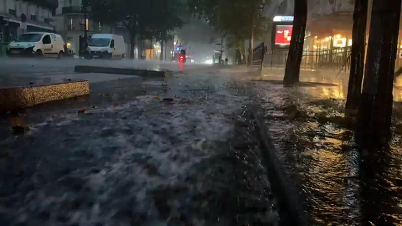 Paris streets flood as storm hits amid heatwave