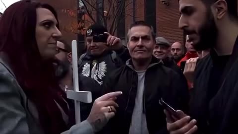 Cross-Holding Lady Knows Koran Better Than 'Devout' Muslim Who Claims Islam Is Peaceful