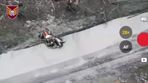 Russian Soldier on Dirt Bike Hit by Drone Immediately After Crashing into Massive Crater