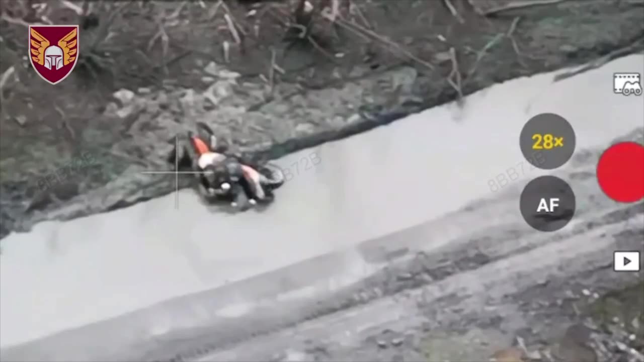 Russian Soldier on Dirt Bike Hit by Drone Immediately After Crashing into Massive Crater