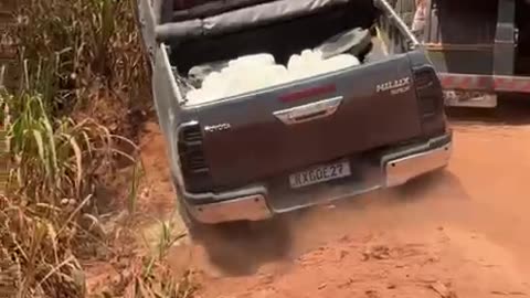 Truck Gets Stuck on Narrow Dirt Road Going Around Semi