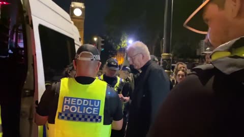 The British police charged a vicar under the Terrorism Act for holding a sign and opposing genocide