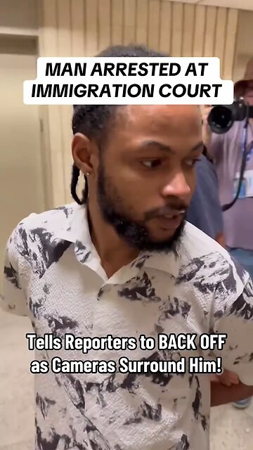 Man arrested at Immigration Court yells at press to back off as cameras swarm around him