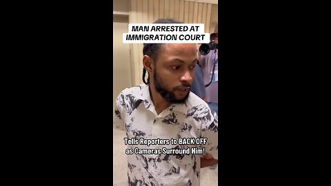 Man arrested at Immigration Court yells at press to back off as cameras swarm around him