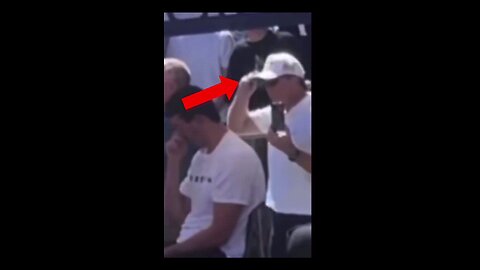 Watch closely: 1. The man in front tips his hat. 2