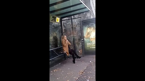 Woman is freezing while waiting for the bus