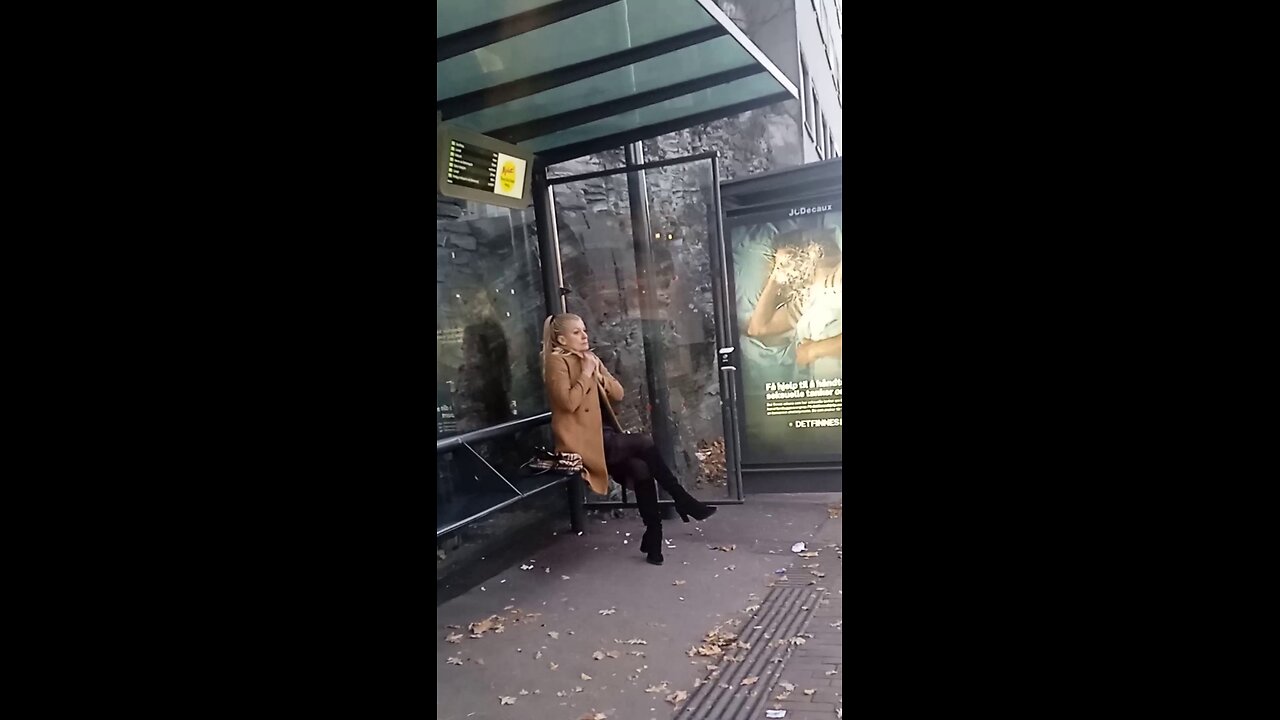 Woman is freezing while waiting for the bus