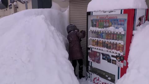 Record snow buries roads and grounds flights in northern Japan