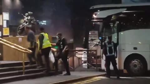Bus loads of Migrants are ferried into a Luxury Hotel in Canary Wharf, London