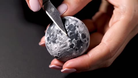 Cutting the Moon in half, revealing cheese