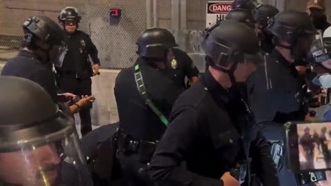 Demonstrator Detained For Battery on a Police Officer