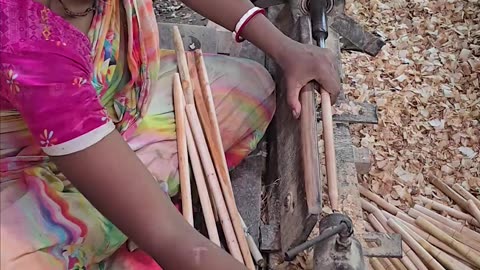 A woman making amazing wooden sticks