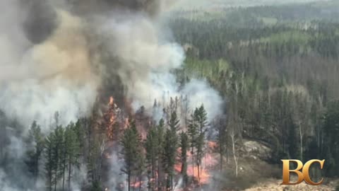 Western Canada wildfires emergency hits another province as thousands flee