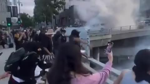 LA Riots - Peaceful Protesters throwing rocks off bridges at Police