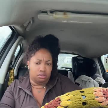 Black woman shows off the food she just stole from a store.