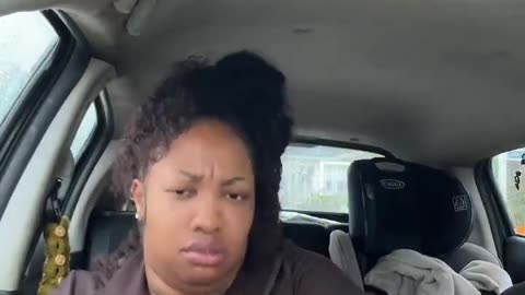 Black woman shows off the food she just stole from a store.